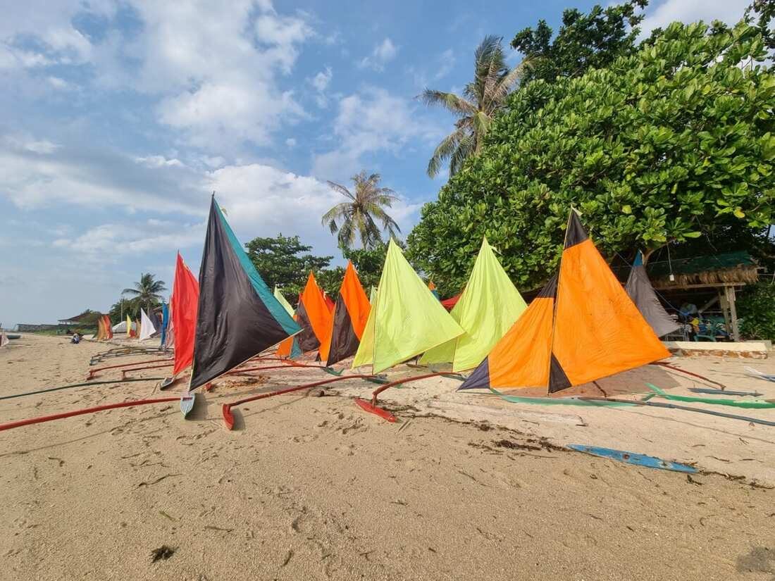 Sails lined up on the beach at the Selatan race, 2025